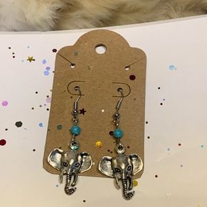 Silver tone dangling elephant earring set